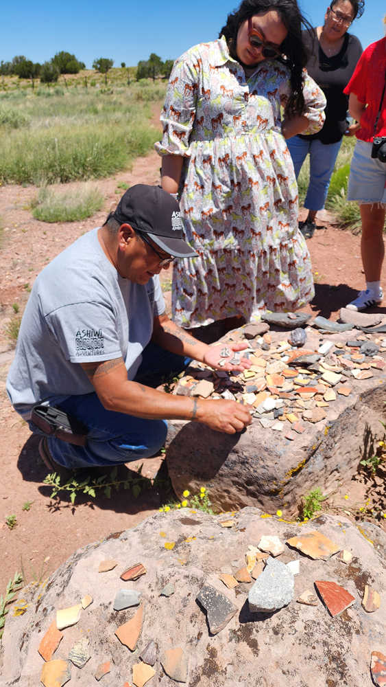 Visit Gallup, Zuni Pueblo. Kenny teaches influencers about Zuni pottery.